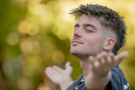 relaxed young man breathing outdoors