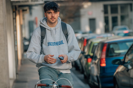 student on the street riding a vintage bicycle