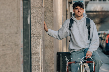 student on the street riding a vintage bicycleの写真素材