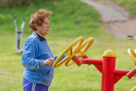 senior couple practicing exercise outdoorsの写真素材