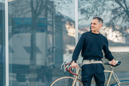urban young man with bicycle on the streetの写真素材