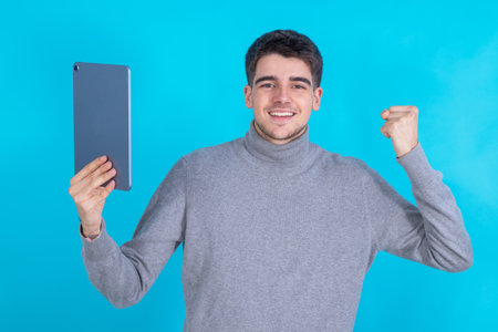 isolated young man with tablet or laptopの写真素材