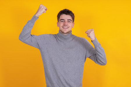 teenager celebrating isolated on backgroundの写真素材