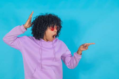 afro american girl with sunglasses isolated on backgroundの写真素材