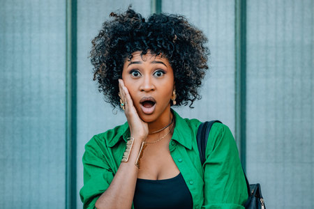 portrait of an afro woman with a surprised expression