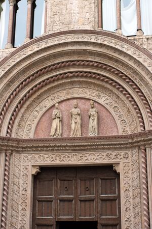 Entrance door to a historic palace in the center of Perugia, Italyのeditorial素材