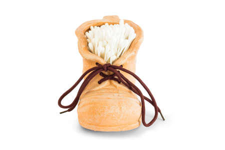 Playing a shoe in crock inside with cotton swabs for cleaning and personal hygieneの写真素材