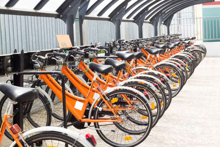Photo by many bicycles locked in the same stationのeditorial素材