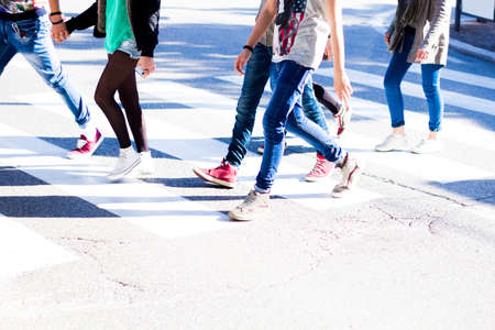 Fashionable young people take a step forward on the roadのeditorial素材