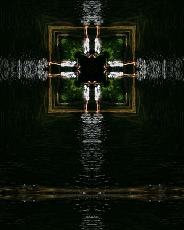 kaleidoscope cross:  young woman wadingの写真素材