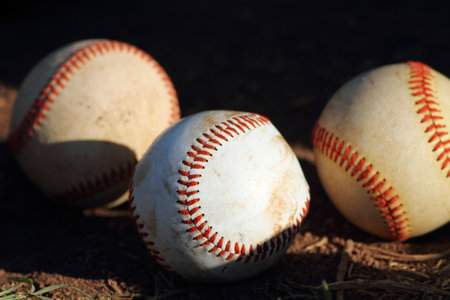 three baseballs in sunの写真素材