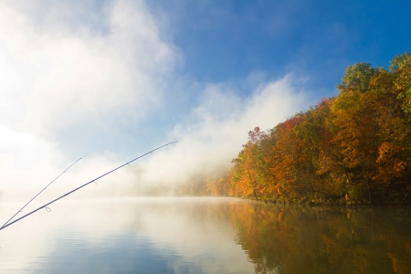 fishing poles on foggy fall morning, Missouri lake, 
