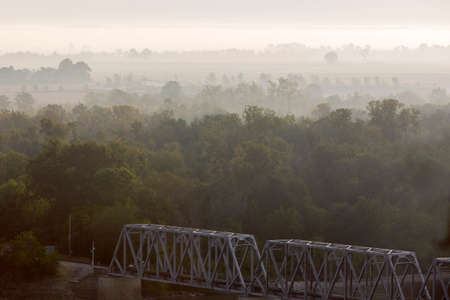 misty morning at Hannibal, Missouri, railroad bridge over Mississippi River