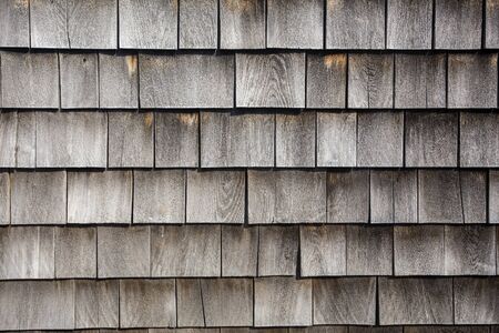 rows of weathered wood shingles, barn sidingの写真素材