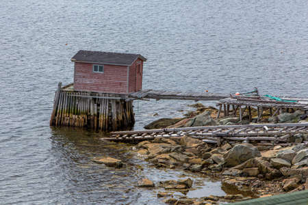 old fishing stage building on water; Fogo Island, Newfoundlandの写真素材