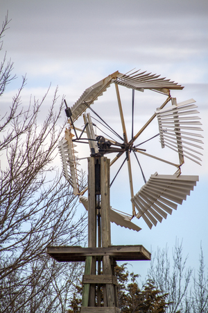 old traditional windmill with wooden blades, Kansasの写真素材