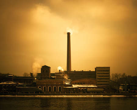 Old factory from a red bricks. Environmental pollution and destruction of ozonosphere.の写真素材
