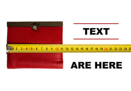 Red wallet and yellow tape measure isolated on a white backgroundの写真素材