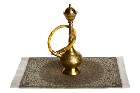 Small hookah on Iranian rug. Isolated on white.の写真素材
