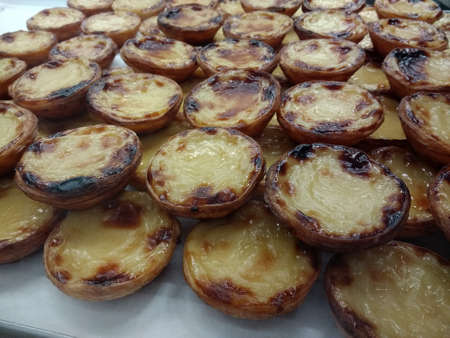 Close up of pastel de nata pastries the tray freshly delicious tasty baked hot custard pastries laid...