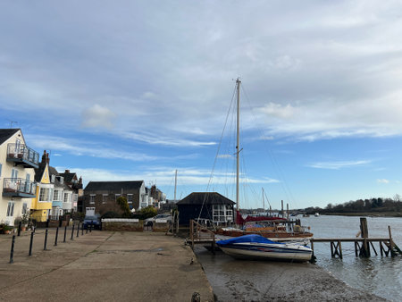 Boats moored at the pier on a sunny winter day in Wiltshire, England.