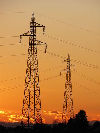 electric tower silhouette for during sunsetの写真素材