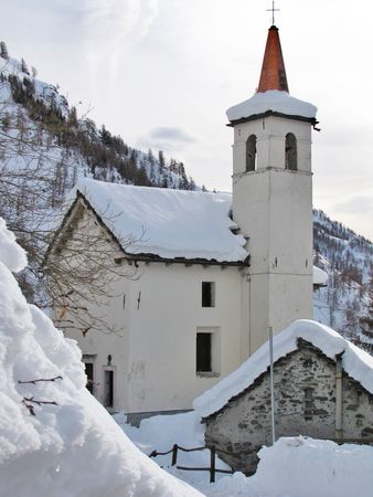 church under snow on mountainの写真素材