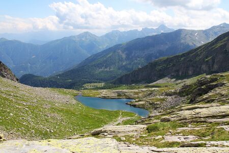 alpine lake on the top of the mountainの写真素材