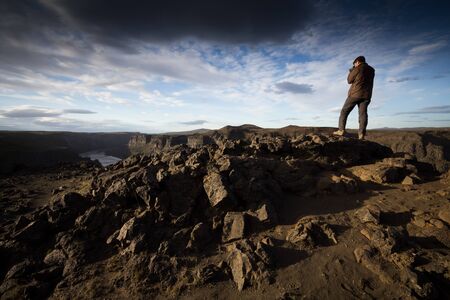 photographer shooting on the canyonの写真素材