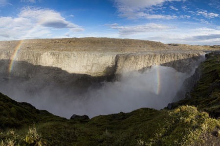 perfect rainbow with majestic waterfall