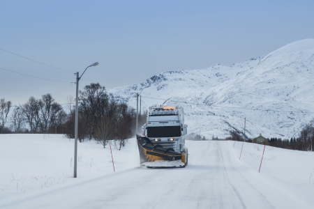 cleaning the road during winter timeの写真素材