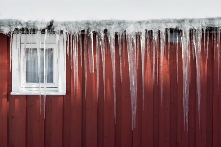white and red home under the snowの写真素材