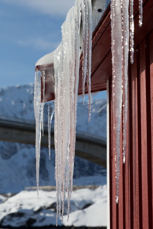 group of icicles on the roofの写真素材