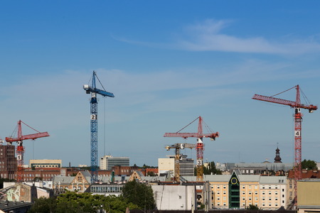 cranes build new city buildingの写真素材