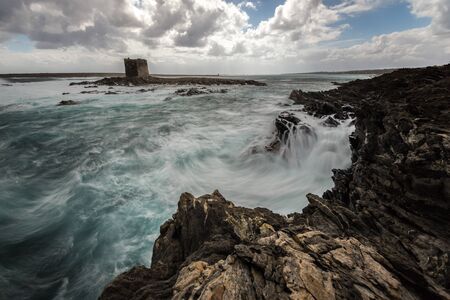 ocean waves on the rockの写真素材