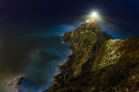 lighthouse light  switched on during nightの写真素材