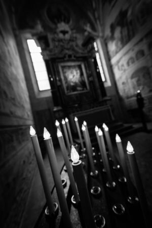 candles into a catholic  churchの写真素材