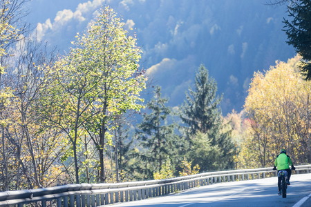 biking to mountain in autumn timeの写真素材