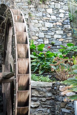 mill wheel close to gardenの写真素材