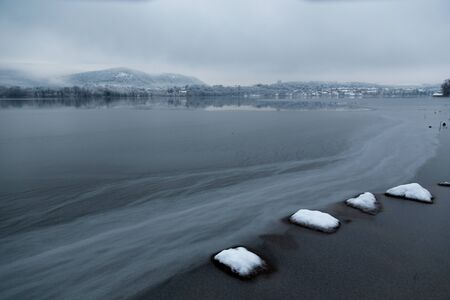 frozen lake during winter seasonの写真素材