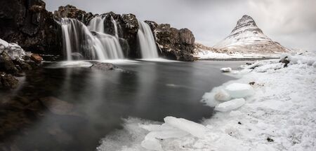 kirkjufellsfoss waterfall in winter timeの写真素材