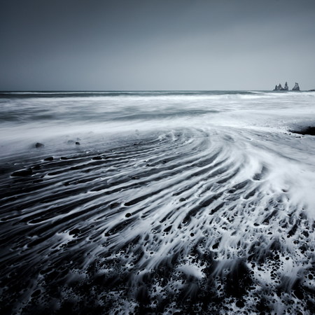 Vik stacks and water foamの写真素材