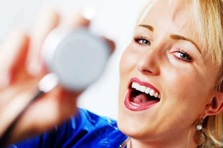 Happy smiling healthcare professional against a white background.の写真素材