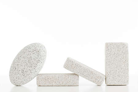 Pumice stones against a white background, sleight reflection.の写真素材