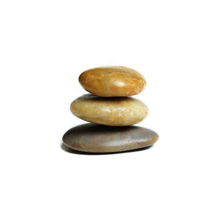 Stack of stones against a white background.の写真素材