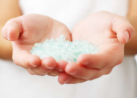 Closeup of womans hands holding spa treatment.の写真素材