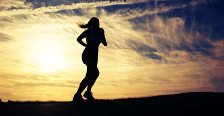 Beautiful young woman runner having a workout session.の写真素材