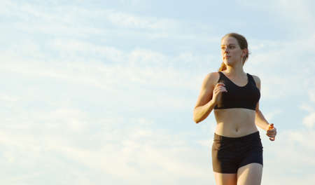 Beautiful young woman runner having a workout session.の写真素材