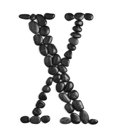 Black rock letter photographed against a white background.の写真素材