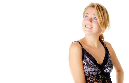 Young woman in a dress posing against a white background.